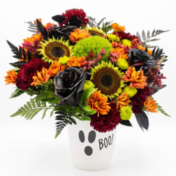 Halloween bouquet in a white vase with "BOO!" text