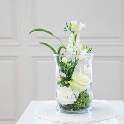 White floral arrangement in a clear glass vase