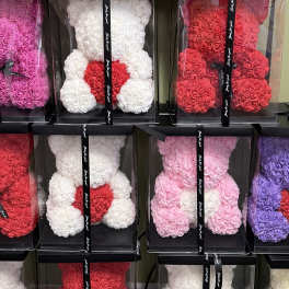 Boxed teddy bears made of roses in red, white, pink, and purple