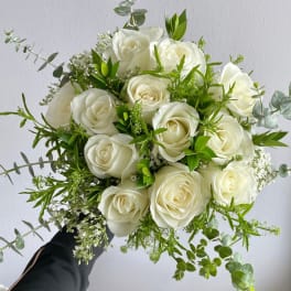 White rose bouquet with green foliage and eucalyptus
