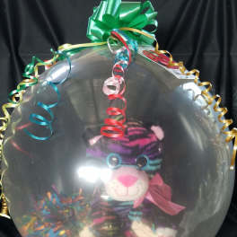 Clear balloon with a plush tiger and colorful curling ribbons