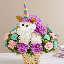 Unicorn-shaped flower basket with rainbow horn and pastel blooms