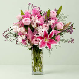 Pink and white mixed bouquet in a clear glass vase
