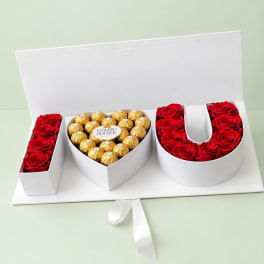 Heart-shaped rose and chocolate gift box with red roses and Ferrero Rocher candies