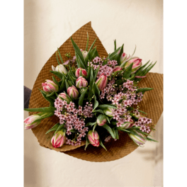 Pink tulip bouquet wrapped in brown paper