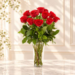 Bouquet of red roses in a clear glass vase