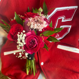 Red rose bouquet with pink and white filler flowers