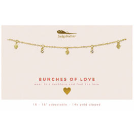 Gold charm necklace with small heart and crystal pendants on a cream card reading 'Bunches of Love'.