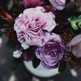 Bouquet of lavender and purple ranunculus in a vase