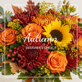 Autumn bouquet with orange roses, sunflowers, and burgundy mums