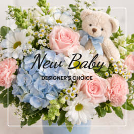 Pastel flower arrangement with a teddy bear and "New Baby" text overlay