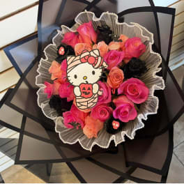 Pink and peach rose bouquet with a Hello Kitty topper