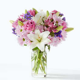 Pink and white mixed bouquet in a clear glass vase