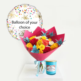 Bouquet with a confetti balloon and a blue candle