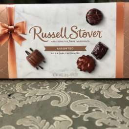 Box of assorted Russell Stover milk and dark chocolates