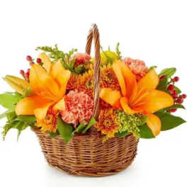 Basket of orange lilies and mixed flowers