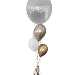 Cluster of metallic and clear balloons with ribbon tassels