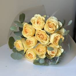 Bouquet of pale yellow roses with eucalyptus foliage