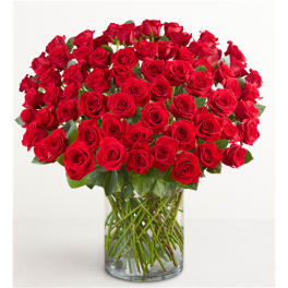 Large bouquet of red roses in a clear glass vase
