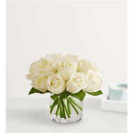 White rose bouquet in a clear glass vase