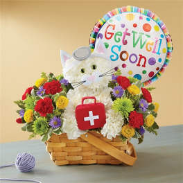 Basket arrangement with a cat-shaped floral design and a "Get Well Soon" balloon