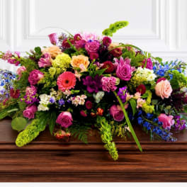 Colorful mixed flower arrangement on a wooden table