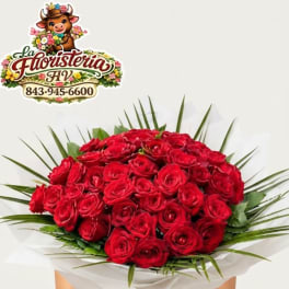 Bouquet of red roses with palm fronds and white wrap