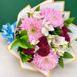 Pink and burgundy chrysanthemum bouquet with white alstroemeria and a blue ribbon