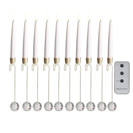 Set of white taper candles with crystal drops and a remote control