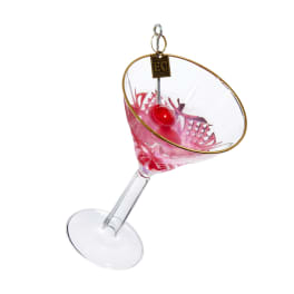 Decorative martini glass ornament with pink liquid and a red cherry