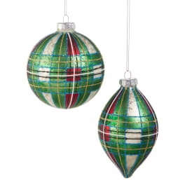 Two colorful plaid Christmas ornaments hanging on white strings