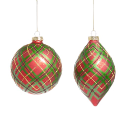 Two red and green plaid Christmas ornaments hanging on white strings