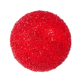 Red glittery spherical decorative object on a white background