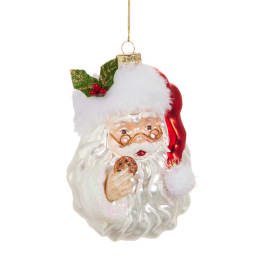 Santa Claus Christmas ornament holding a cookie