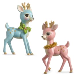 Two glittery deer figurines, one blue and one pink, on a white background