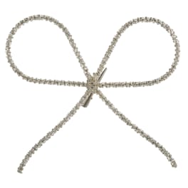 Silver rhinestone bow hair accessory on a white background