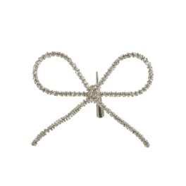 Silver rhinestone bow ornament on a white background