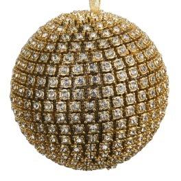 Gold beaded ornament covered in clear rhinestones