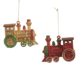 Two glittery train ornaments in red, green, and gold hang on white background.
