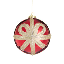 Red Christmas ornament with a gold glitter bow design