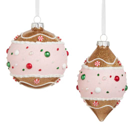 Two glittery pink and gold Christmas ornament decorations with candy details