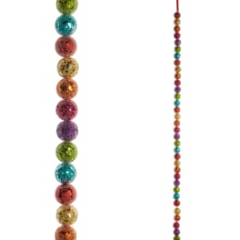 Strands of glittery multicolor beads on a white background