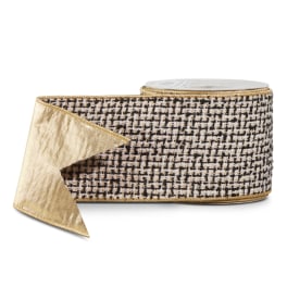 Roll of patterned gold and black ribbon with a sheer gold tail