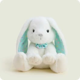 White plush bunny with long ears and a blue bow tie