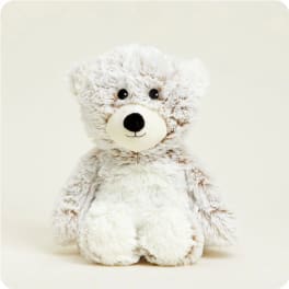 Plush teddy bear with white and tan fur on a plain background