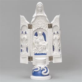 White religious statue with blue accents on a pedestal