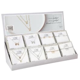 Display box of packaged necklaces with faith-themed cards