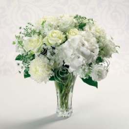 White floral bouquet in a clear glass vase