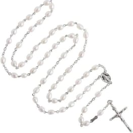 Pearl rosary with silver chain and crucifix on a white background