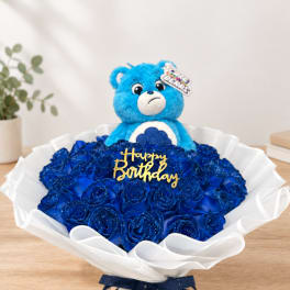 Blue rose bouquet with a teddy bear and Happy Birthday topper